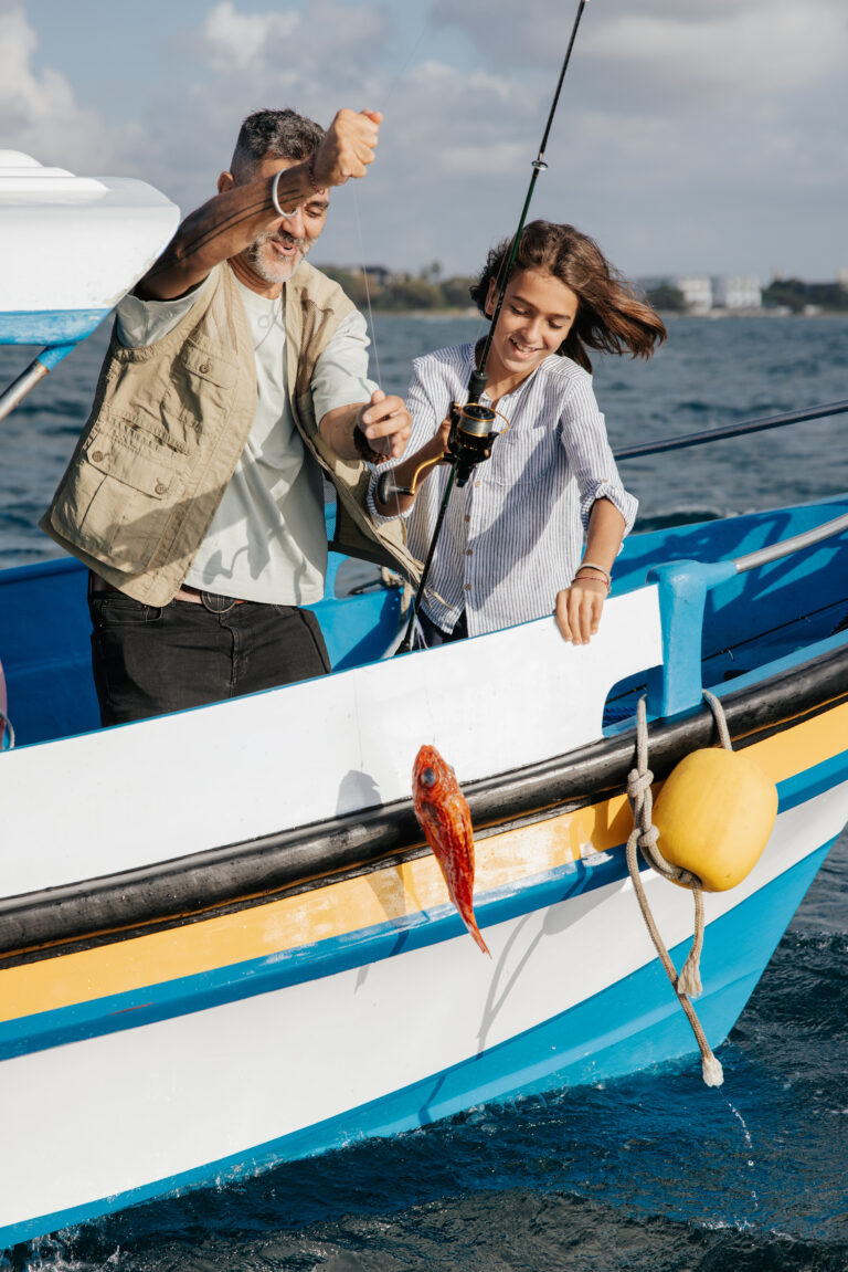 Guests boarding a fishing boat for the Catch & Grill experience