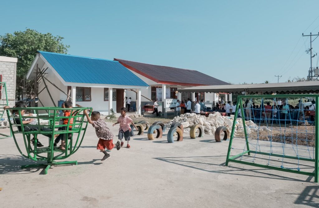 Children playing outside the newly opened TK Negeri Poma school in Southwest Sumba